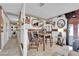 Cozy dining area featuring a table for four, tile flooring, elegant decor, and natural light at 3920 Geist Ave, Las Vegas, NV 89115