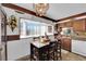 Cozy kitchen featuring a dining area, and ample cabinet space for storage with bright natural light at 3920 Geist Ave, Las Vegas, NV 89115