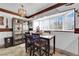 Cozy dining area with display cabinet, chandelier, and bright natural light from window at 3920 Geist Ave, Las Vegas, NV 89115