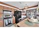 Classic kitchen featuring wooden cabinets, stainless steel appliances, and adjacent dining area at 3920 Geist Ave, Las Vegas, NV 89115