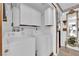 Efficient laundry room with washer, dryer, and storage cabinets, offering convenience and organization at 3920 Geist Ave, Las Vegas, NV 89115