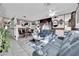 Bright and airy living room with comfortable leather seating, tile flooring, decorative accents, and ample space for relaxation at 3920 Geist Ave, Las Vegas, NV 89115