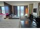 Modern bedroom features a comfortable seating area, city views, and stylish decor at 4381 W Flamingo Rd # 903, Las Vegas, NV 89103