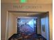 Hallway entrance leading to Palms Casino with bright overhead lighting and exit sign at 4381 W Flamingo Rd # 903, Las Vegas, NV 89103