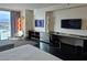 Relaxing room with city view, entertainment center, and sleek workspace, creating a comfortable retreat at 4381 W Flamingo Rd # 903, Las Vegas, NV 89103
