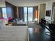 Comfortable room with large balcony, city views, a well-furnished living space, and entertainment center at 4381 W Flamingo Rd # 903, Las Vegas, NV 89103
