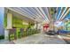 Stylish outdoor bar area with seating, a bar, and a partial view of the pool at 4381 W Flamingo Rd # 903, Las Vegas, NV 89103
