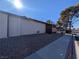 View of the exterior of the home with gravel landscaping and a sidewalk at 441 N Lamb Blvd # E, Las Vegas, NV 89110