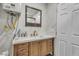 Bathroom vanity features modern sink, faucet, and wood cabinets, with a mirror and door at 4587 Yellow Pine Ave, Mount Charleston, NV 89124
