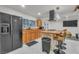 Modern kitchen featuring stone counter seating, stainless appliances, and ample counter space at 4587 Yellow Pine Ave, Mount Charleston, NV 89124