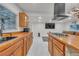 Bright kitchen featuring stone counter seating and ample cabinet space at 4587 Yellow Pine Ave, Mount Charleston, NV 89124