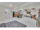 Spacious open floor plan featuring a modern kitchen, sleek bar, and inviting living space at 4587 Yellow Pine Ave, Mount Charleston, NV 89124