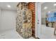 Interior features a stone fireplace and doorway with a view of a modern bar and seating area at 4587 Yellow Pine Ave, Mount Charleston, NV 89124