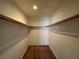 Walk-in closet with ample hanging space and storage shelves, providing organized storage solutions at 5024 S Rainbow Blvd # 203, Las Vegas, NV 89118