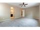 This is a spacious bedroom with neutral walls and carpet, and an attached bathroom at 5646 Sophie Belle Ave, Las Vegas, NV 89131