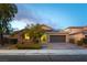 Charming single-story home with a well-manicured front yard and a two-car garage at 5646 Sophie Belle Ave, Las Vegas, NV 89131