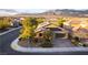 Aerial view of home on corner lot, featuring solar panels and desert landscaping at 5646 Sophie Belle Ave, Las Vegas, NV 89131