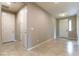 Hallway view showing tile flooring and multiple white doors at 5646 Sophie Belle Ave, Las Vegas, NV 89131