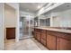 Modern bathroom featuring a glass enclosed shower and double vanity at 5928 Radiance Park St, North Las Vegas, NV 89081