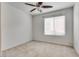 Comfortable bedroom featuring a ceiling fan and a bright window at 5928 Radiance Park St, North Las Vegas, NV 89081