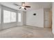 Bright bedroom featuring a ceiling fan and light-filled windows at 5928 Radiance Park St, North Las Vegas, NV 89081