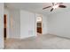 Large bedroom leading to the bathroom with a ceiling fan at 5928 Radiance Park St, North Las Vegas, NV 89081