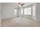 Spacious bedroom with multiple windows and a ceiling fan at 5928 Radiance Park St, North Las Vegas, NV 89081