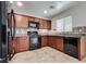 Updated kitchen featuring stainless steel appliances, granite countertops, and a bright window at 5928 Radiance Park St, North Las Vegas, NV 89081