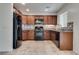 Updated kitchen featuring stainless steel appliances, granite countertops, and mosaic backsplash at 5928 Radiance Park St, North Las Vegas, NV 89081