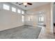 Bright living room featuring high ceilings, tile floors, and neutral-colored walls at 5928 Radiance Park St, North Las Vegas, NV 89081