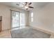 Open-concept area featuring carpet, tile floors, and sliding glass doors to outside at 5928 Radiance Park St, North Las Vegas, NV 89081