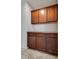 Charming pantry with ample storage and wood cabinets for kitchen essentials at 5928 Radiance Park St, North Las Vegas, NV 89081