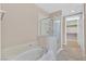 Bright bathroom featuring a separate tub and shower at 62 E Serene Ave # 114, Las Vegas, NV 89123