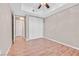 Bedroom with wood-look floors and a double-door closet at 62 E Serene Ave # 114, Las Vegas, NV 89123