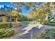 Outdoor community grill and seating area surrounded by greenery and walkways at 62 E Serene Ave # 114, Las Vegas, NV 89123
