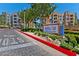 Manhattan Condominiums community entrance with colorful building exteriors and manicured landscaping at 62 E Serene Ave # 114, Las Vegas, NV 89123