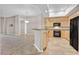 Open kitchen features light wood cabinets, black appliances, granite counters, and a breakfast bar at 62 E Serene Ave # 114, Las Vegas, NV 89123