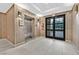 Lobby area with an elevator and entrance/exit doors for access to the building and parking at 62 E Serene Ave # 114, Las Vegas, NV 89123