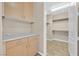 Hallway with cabinets and a walk-in closet with shelving at 62 E Serene Ave # 114, Las Vegas, NV 89123