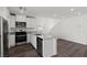 Well-lit kitchen boasts stainless steel appliances, sleek countertops, white cabinetry, and an open layout at 6252 Blood Lily Ave, Las Vegas, NV 89122