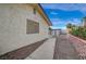 Exterior view of the backyard featuring low-maintenance landscaping and block wall fencing at 6870 Laronda Ln, Las Vegas, NV 89156