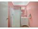 Pink bathroom featuring a glass enclosed shower, vanity and lighting at 6870 Laronda Ln, Las Vegas, NV 89156