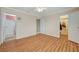 Bedroom featuring wood-look floors, a ceiling fan, and access to the bathroom at 6870 Laronda Ln, Las Vegas, NV 89156