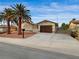 Charming single-story home featuring desert landscaping, a two-car garage, and gated courtyard at 6870 Laronda Ln, Las Vegas, NV 89156