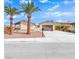 Charming single-story home with a two-car garage, desert landscaping, and two palm trees in the front yard at 6870 Laronda Ln, Las Vegas, NV 89156