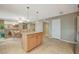 A large kitchen with a center island for more counter space and lots of lighting at 6870 Laronda Ln, Las Vegas, NV 89156