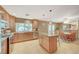 Eat-in kitchen features modern appliances, an island, and tile flooring at 6870 Laronda Ln, Las Vegas, NV 89156