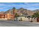 Neighborhood street with a house and mountain in the background at 6870 Laronda Ln, Las Vegas, NV 89156