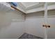 Carpeted walk-in closet featuring top shelf and pole for hanging clothes at 6870 Laronda Ln, Las Vegas, NV 89156
