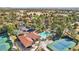 An aerial view of the property shows a pool, tennis court, parking and the surrounding community at 7315 Mission Hills Dr, Las Vegas, NV 89113